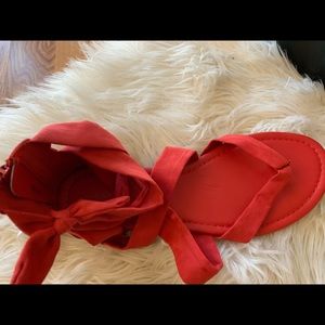 Christian Siriano red zipper sandals with bow tie